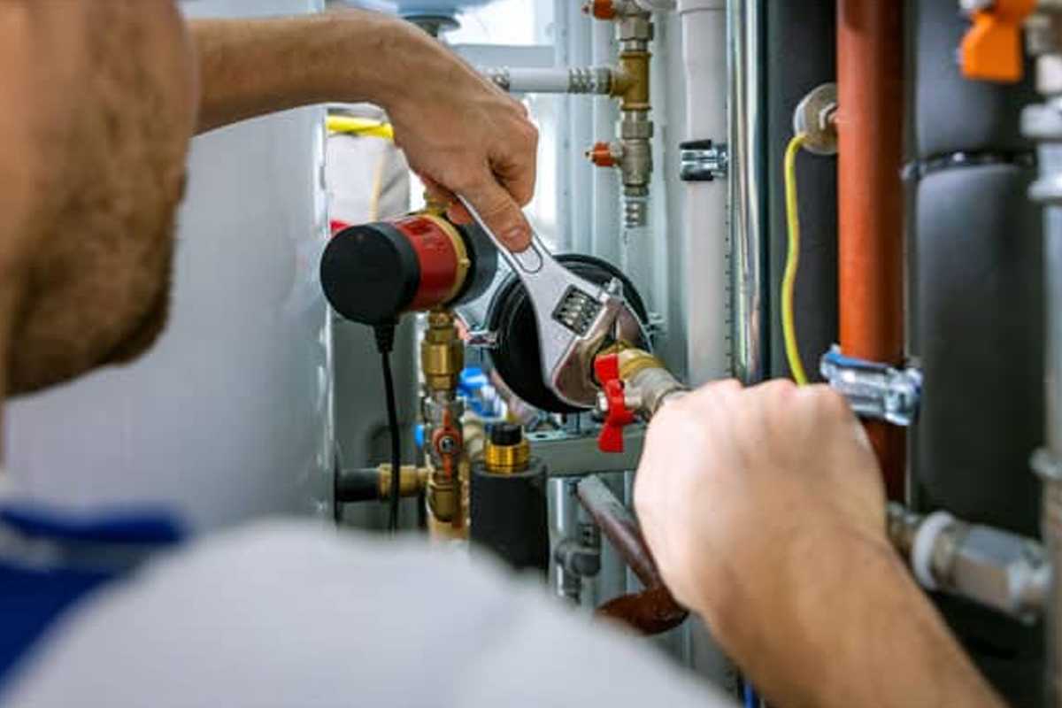 HVAC technician performing humidifier repair in Ottawa home