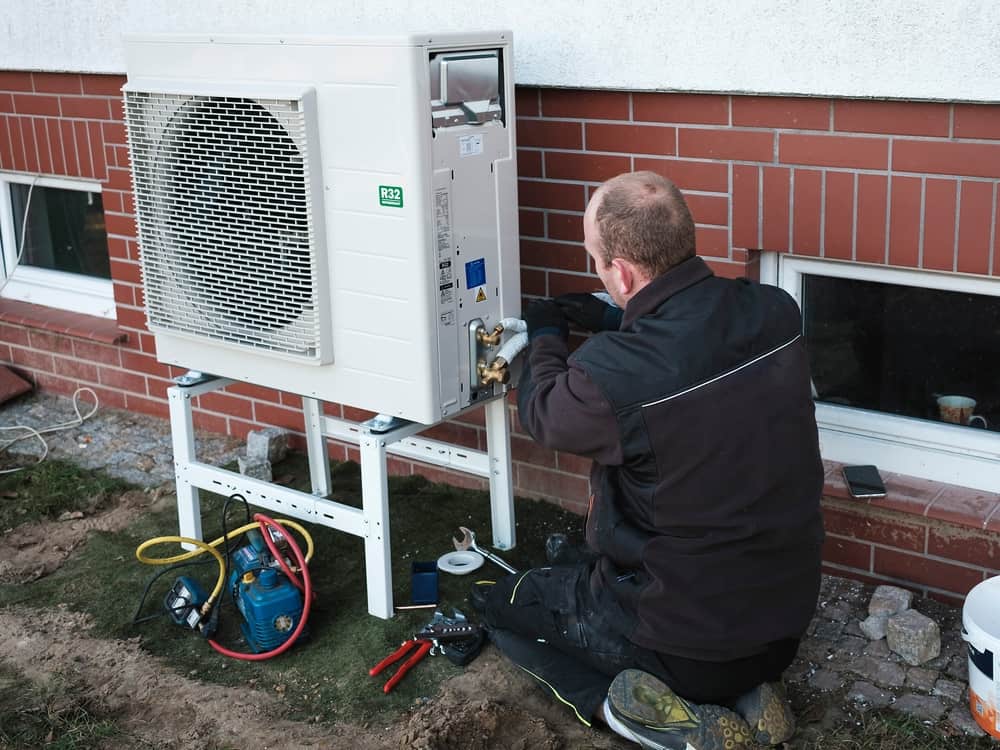 HVAC technician installing heat pump system in Ottawa